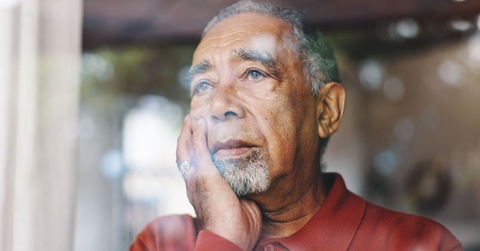 upset older man gazing out window