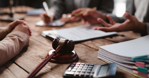 lawyers discussing contract during meeting in office
