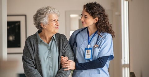 caregiver assist senior woman