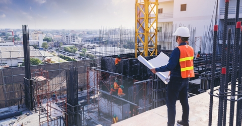 engineer inspecting and working outdoors
