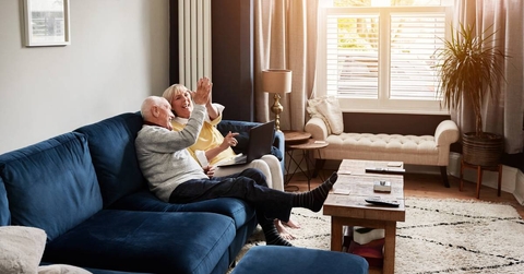 Senior couple on a sofa in the living room of their home
