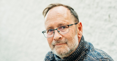 portrait of 50 year old man wearing brown pullover