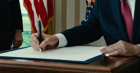 presidents hand signing official documents