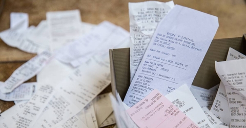 Many tax receipts in box and on table