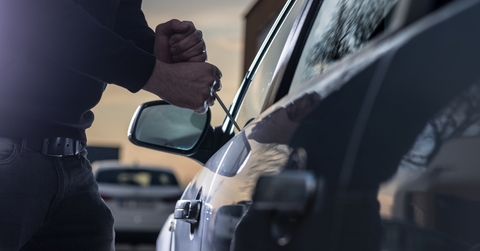 auto thief in black balaclava