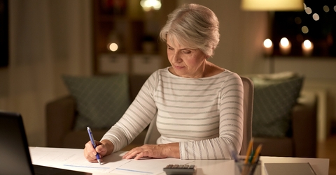 Senior woman doing taxes