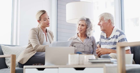 senior couple discussing retirement plan with financial advisor