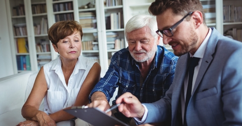 senior couple consulting with financial advisor