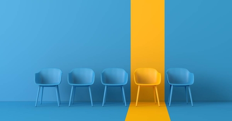 Yellow chair standing out from the crowd