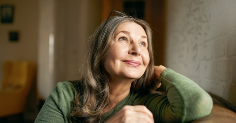 Older woman smiling and looking up