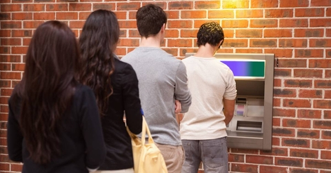 People in line to withdraw cash from ATM