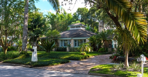 exterior of home with tropical landscaping