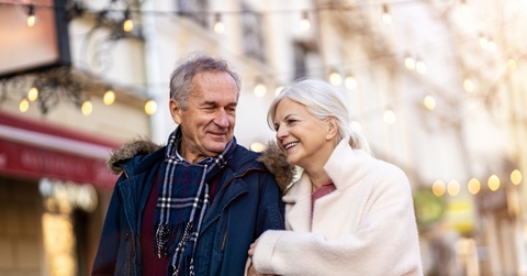 older couple walking outdoors during winter