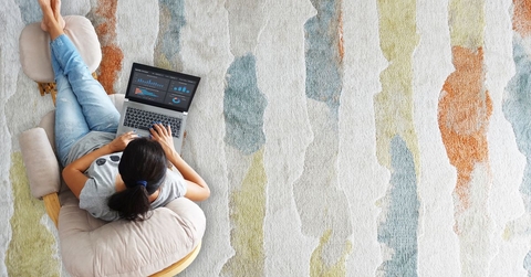 woman working remotely in living room