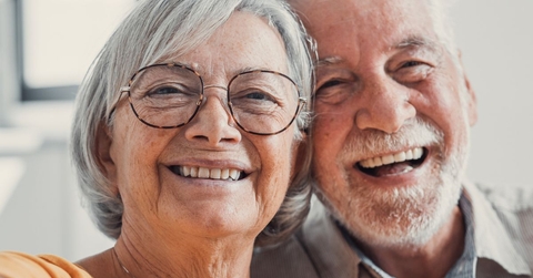 close up of smiling retired couple