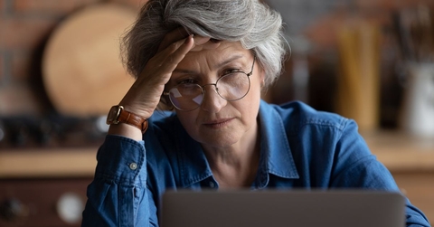 older woman frustrated on laptop