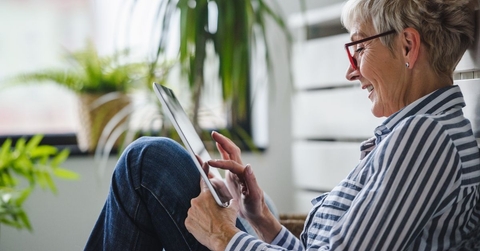 older woman on tablet