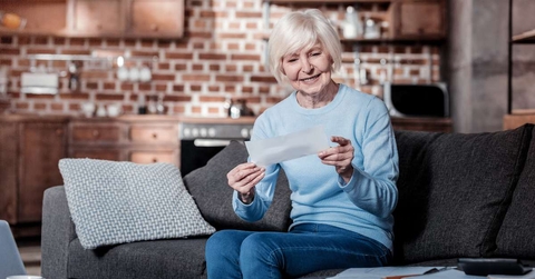 senior woman checking bill