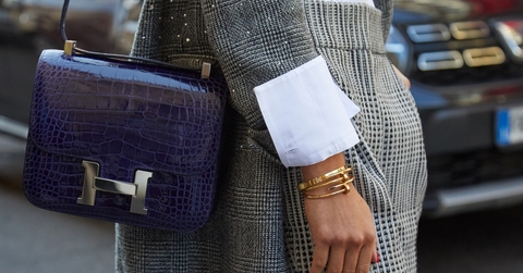 Vintage Hermes bag worn by woman in plaid