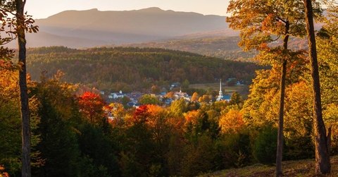 Overlooking a peaceful town in autumn at sunset