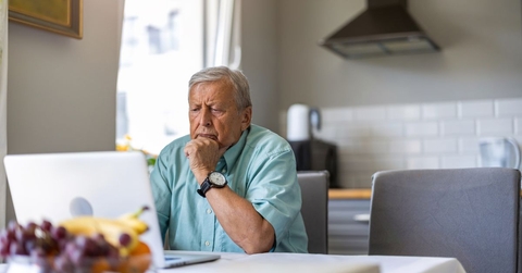 elderly man on laptop
