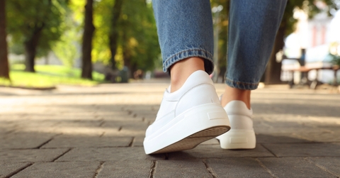 White shoes and jeans walking in the city
