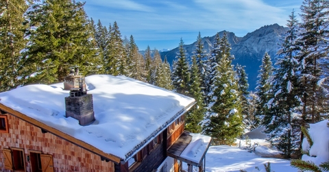 Winter mountain cabin in the snowy forest 