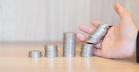 Stacked coins falling