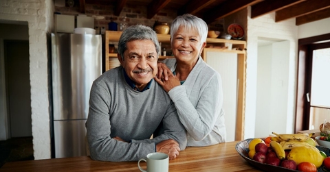 smiling older couple in kitchen