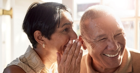 Elderly people sharing a secret