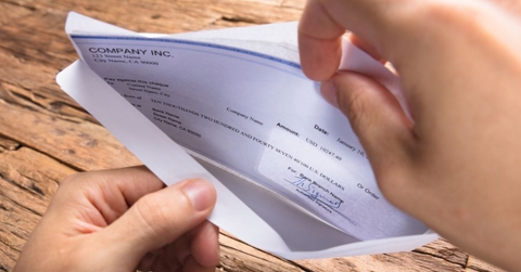 envelope with paycheck