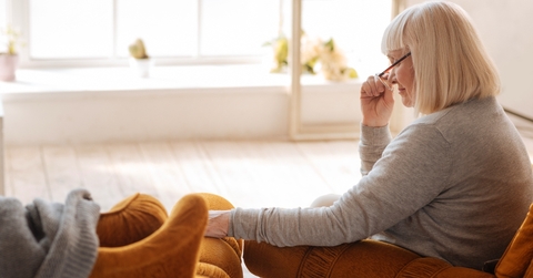 Widow looking at empty chair