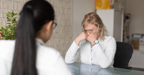 Employee sits in office getting fired