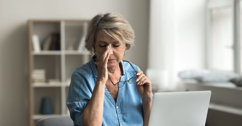 frustrated mature woman on laptop
