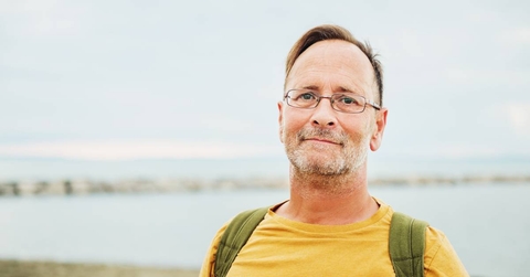 Middle aged man by the ocean