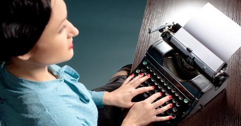 Old school typist with her machine