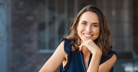 Smiling mature woman in a blue top