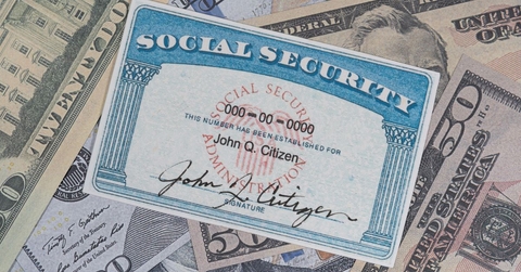 Social Security card on cash
