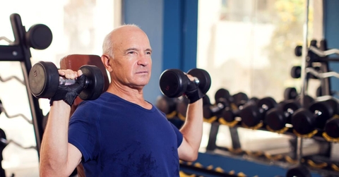 Senior man working out in gym