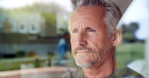 Portrait of a mature man looking out the window