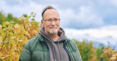 Portrait of a man in his 60s outdoors during autumn
