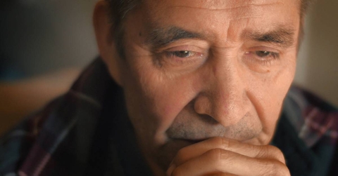 Sad senior man thinking, looking down