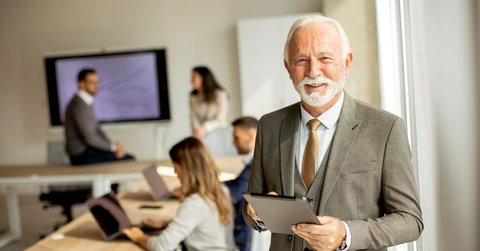 Older business man in a conference room