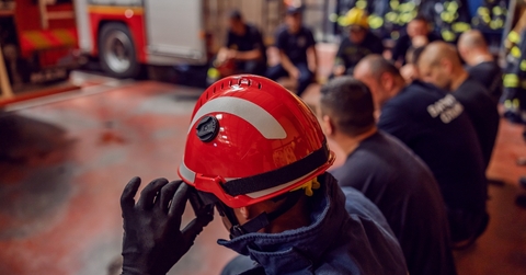 Firemen lined up at the fire station