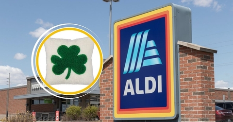 Aldi store sign with St. Patrick's Day clover pillow