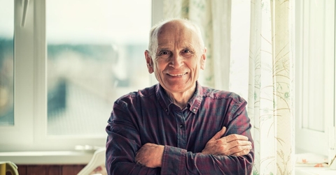 Portrait of a man in his late 60s smiling