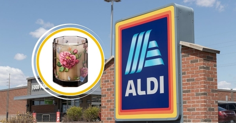 Aldi store sign with floral glass candle