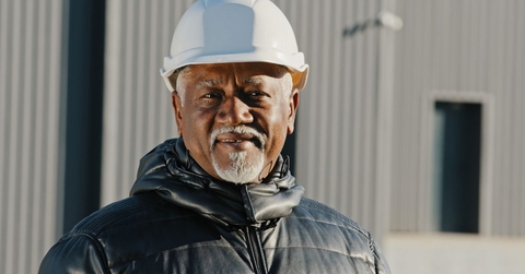 Smiling senior male construction manager