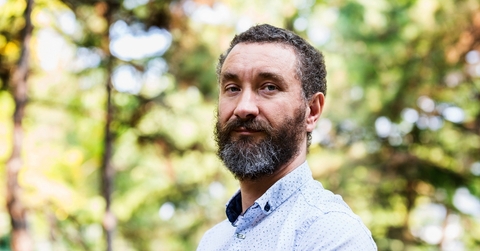 Man in his early 50s looking at camera