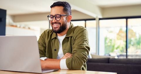 Man smiling working remotely 